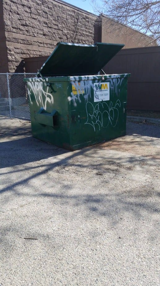 Green dumpster Graffiti
