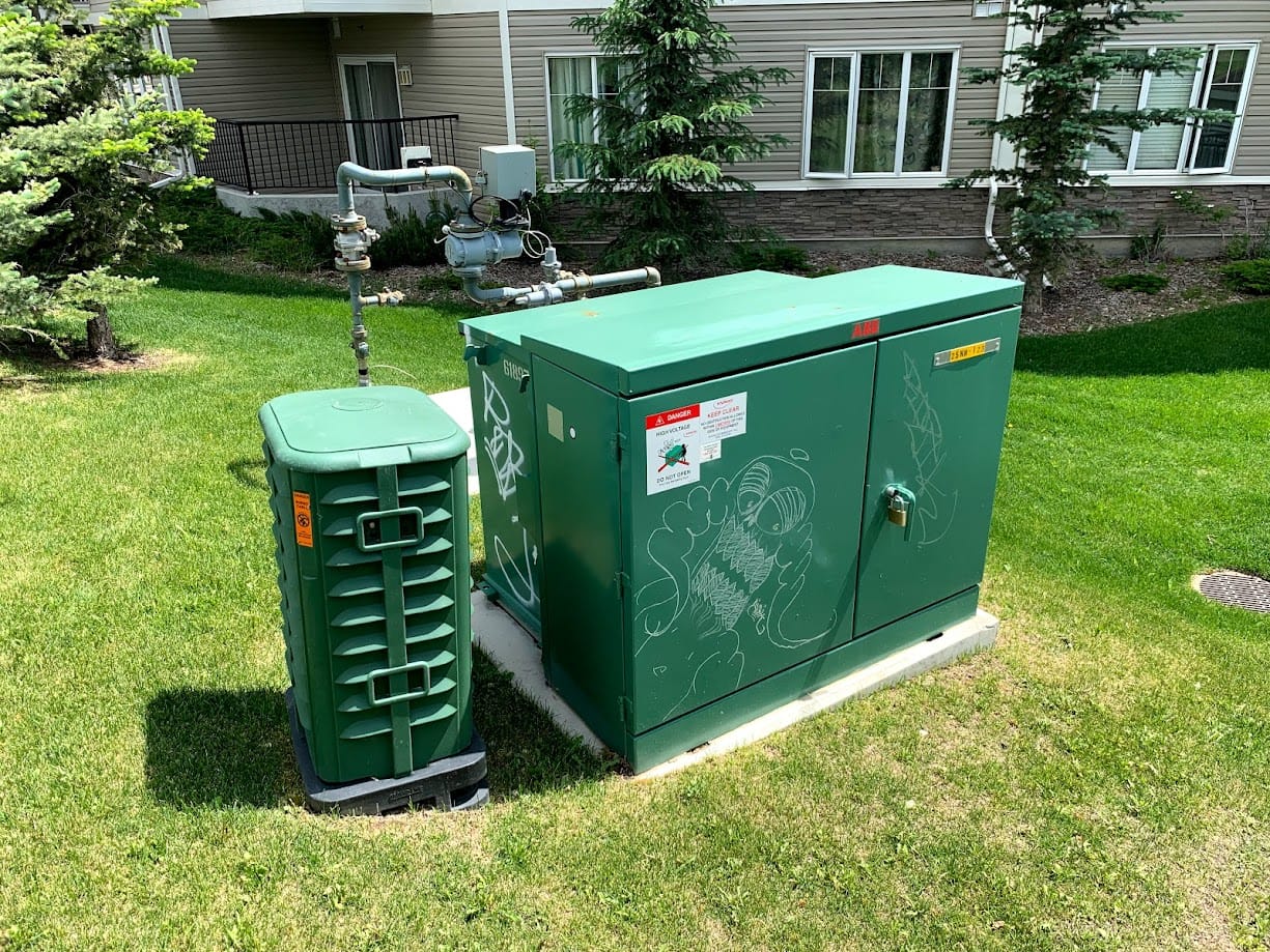 Graffiti on green electrical box