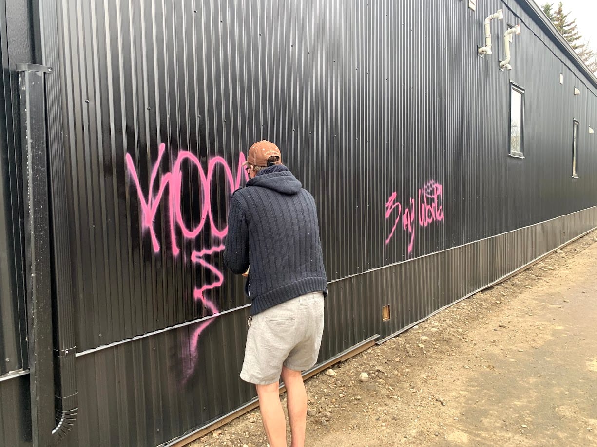 Pink Graffiti on Metal Siding