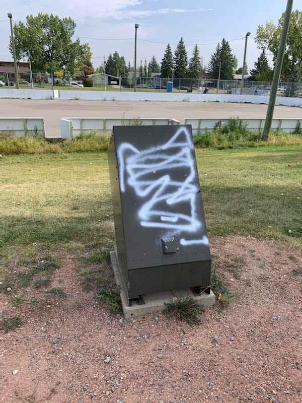 White paint on metal Garbage bin