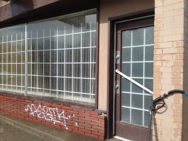 Brick wall graffiti removal